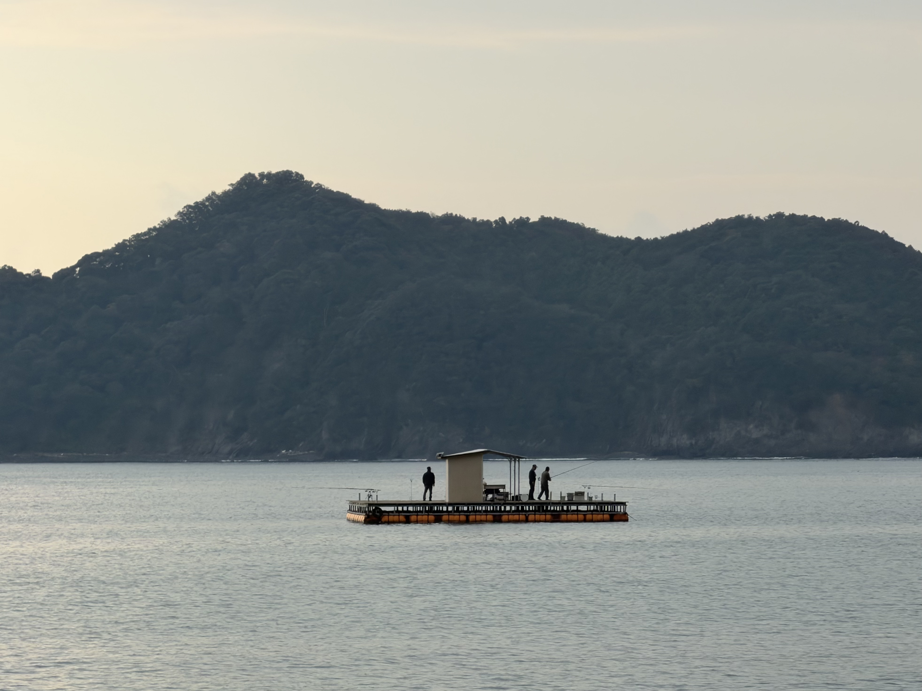 Men fishing in a tropical bay
