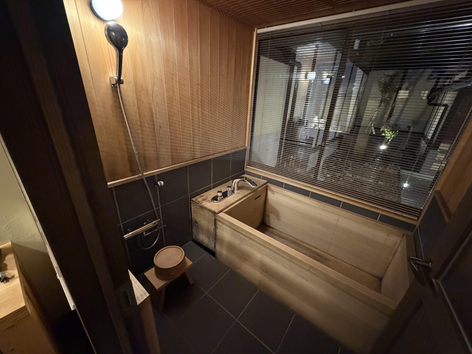 The giant wooden tub and shower stool at our hotel